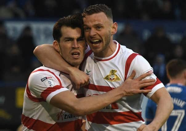 Doncaster's John Marquis (l) celebrates his goal with Andy Boyle