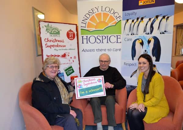 Lindsey Lodge Hospice Superdraw winner Mr and Mrs Hind are pictured first prize sponsor Kerrie James of Jotun Paints (right)