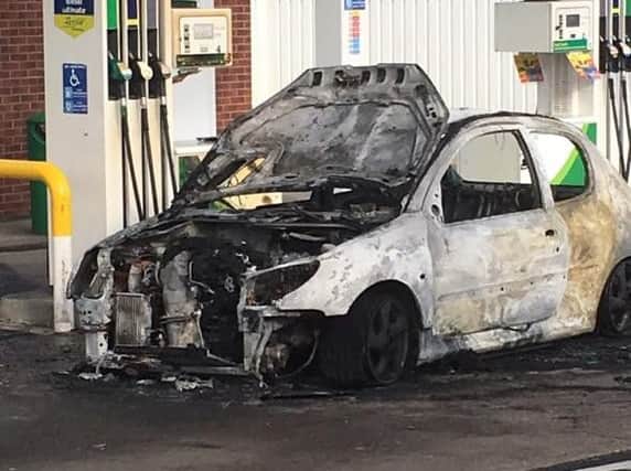 The car was wrecked in the blaze.