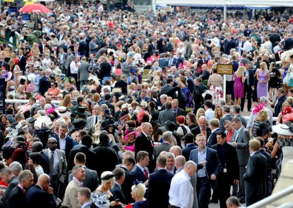 Date:12th September 2013.
The Ladbrokes St Leger Festival at Doncaster Racecourse, DFS Ladies Day. Pictured Crowds attending the meeting.