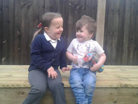 Evia and Elliot in there new garden.