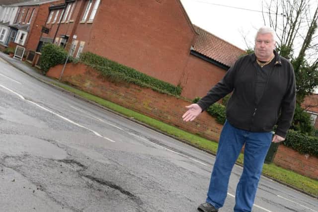 Mick Glynn, pictured by a Pot Hole on Hatfield High Street. Picture: Marie Caley Pot Holes MC 3