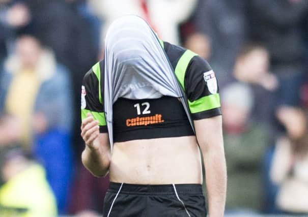 Ben Whiteman covers his face after Rovers lost to a last minute penalty