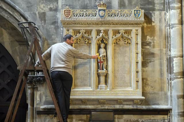 5 Sept 2017...John Adam cleans the newly restored memorial, inside Doncatser Minster, to the men of the Queens Own Yorkshire Dragoons who died during the First World War. Picture Scott Merrylees
