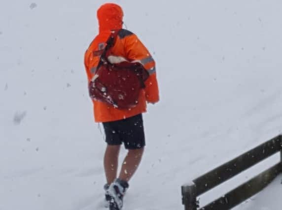 Shorts-clad postman on his round in Sheffield