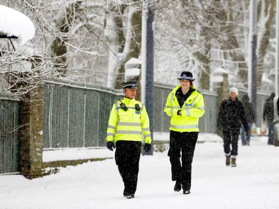 Police in the snow this week. The officer in question is not one of those pictured