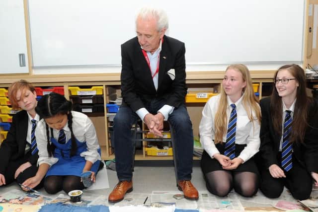 Tony Christie visits pupils at De Warenne Academy who are creating a banner for the Conisborough Music Festival.
