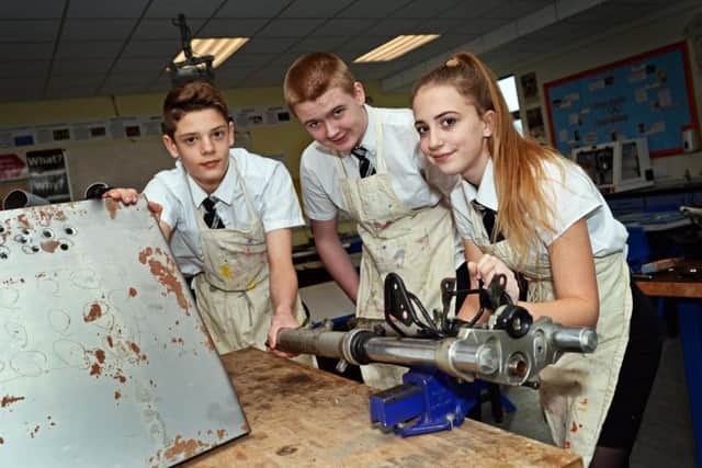 Ethan McGhee, 14, Liam Thornton, 13 and Mollie Nunns, 13, pictured working on the after school Engineering project. Picture: Marie Caley NDFP Armthorpe Academy MC 4