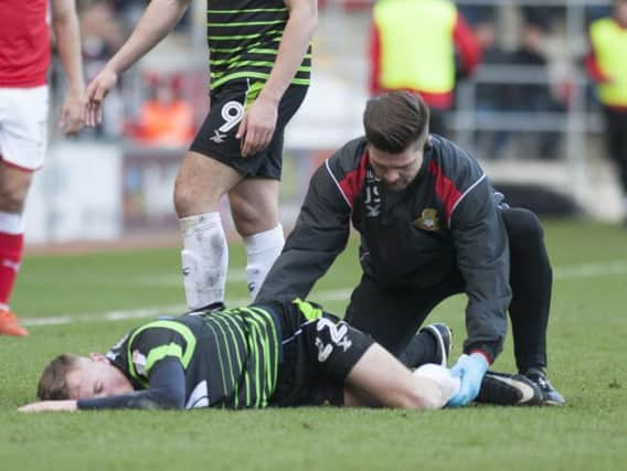 Alfie Beestin is treated for his ankle injury at Rotherham