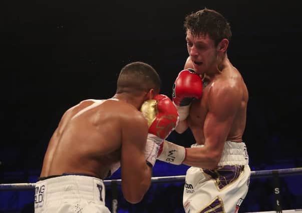 Gavin McDonnell gets the better of Gamal Yafai. Photo: Lawrence Lustig