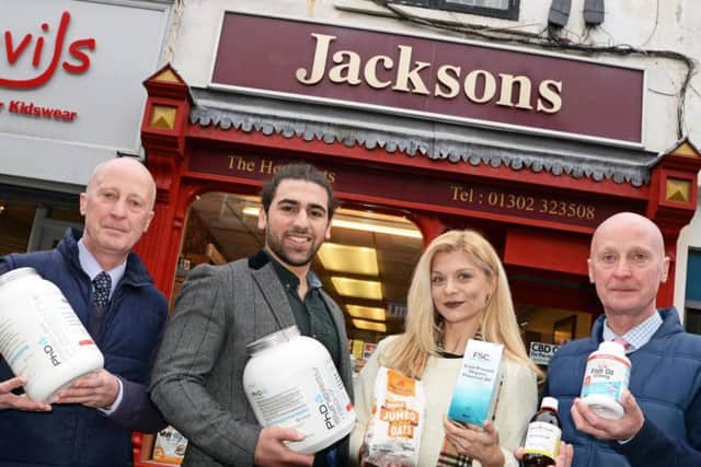 Twins Simon and John Shepherd, pictured at Jacksons Herbalists, on Printing Office Street, with the new owners Arman Mantella and Lydia Georgiou. Picture: Marie Caley NDFP Jacksons New Owners MC 1
