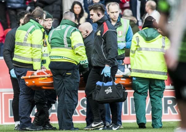 Tom Anderson was stretchered off after breaking his cheekbone at Rotherham United