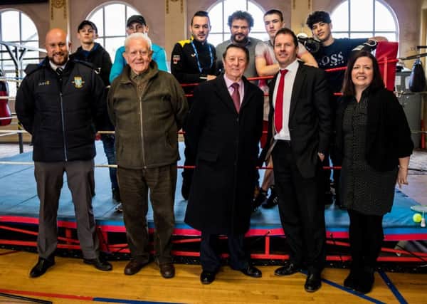 Left to right: Front row - Ricky Hunt from SWFC, Peter Atkinson (Trustee of Dearne Valley Personal Development Centre - DVPDC), Sir Dave Richards, Jason Mace from Gala Tent, Jackie Irwin from DVPDC. Back row - Students from the Dearne Valley Personal Development Centre with Josh Wale (centre) with John Irwin of DVPDC.