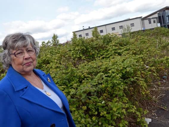 Georgina Mullis, pictured by the former Dixon estate, which she hopes will be redeveloped soon. Picture: Marie Caley NDFP Housing Scheme MC 1