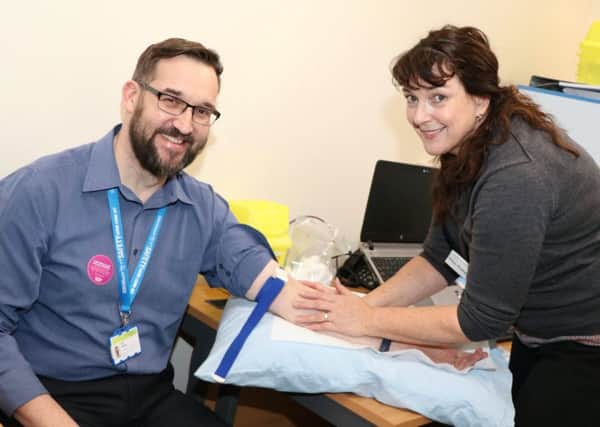 Staff at Rotherham Doncaster and South Humber NHS Foundation Trust (RDaSH) are being offered PSA tests, which measure the amount of prostate specific antigen (PSA) in the blood. Neil Nicklin is pictured having his PSA test by Vivienne Thompson, of the Occupational Health Team