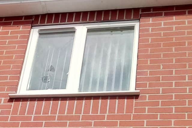 A smashed window at the East Doncaster Development Trust