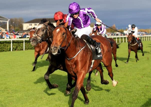 Saxon Warrior wins the Racing Post Trophy at Doncaster for trainer Aidan O'Brien and jockey Ryan Moore.