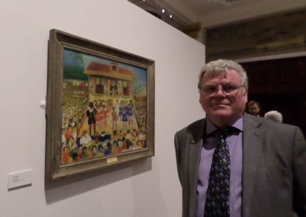 Dave Adgar together with the painting by Luis Soares which is on display at the Brazilian Embassy