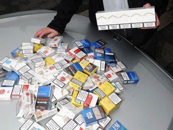 Illicit cigarettes, similar to these, were found at both shops.