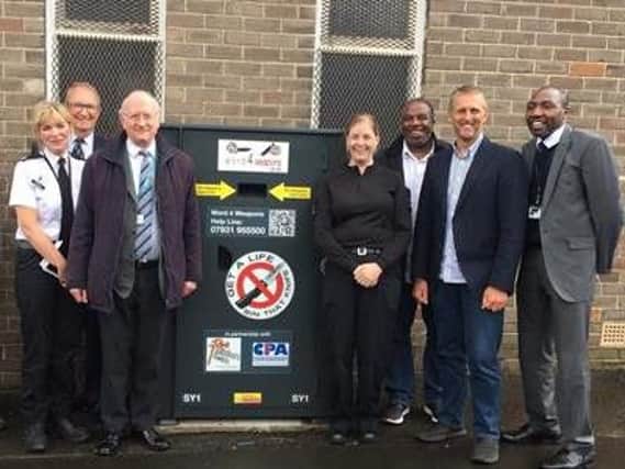 South Yorkshire Police and Crime Commissioner Dr Alan Billings and other attendees join to launch the first knife bin in South Yorkshire