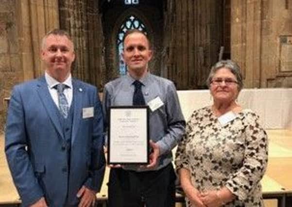 Mark Tolson, Chair of the Doncaster &amp; District Deaf Society
was very proud to receive the prestigious Community
Initiative Award from HRH Duke of York in recognition of
the Societys work and services for the Doncaster Deaf
Community.