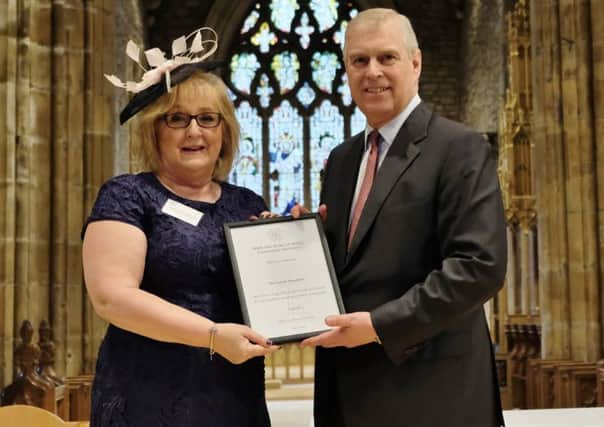 Jackie Hewitt-Main Award OBE receives a  Duke of York Community Initiative Award