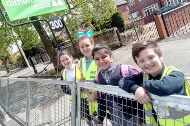 Lakeide Primary School pupils Lily Heap, 10, Imogen Jolly, 10, Inaaya Waqar, nine, and Francis Nickson, at the Tour de Yorkshire in Doncaster with their school.