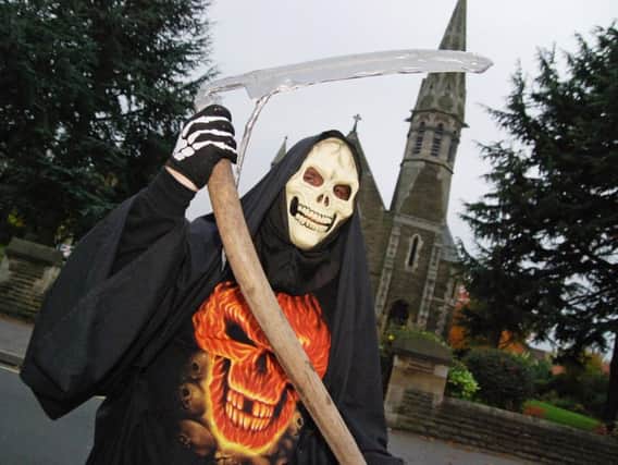 A Halloween Grim Reaper costume