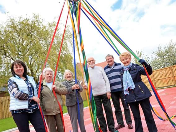 Pictured with the new Maypole l-r Angie Clegg, Harvey Arms Events Manager, Bridget Clark, funding organiser, Patricia Schofield, Chairman of Joint Playing Field committee, Roy Hattersley, Treasurer of JPF, Richard Johnson, JPF Secretary and Shirley Hattersley, supporter.  Picture: Marie Caley NDFP Mayploe MC 1