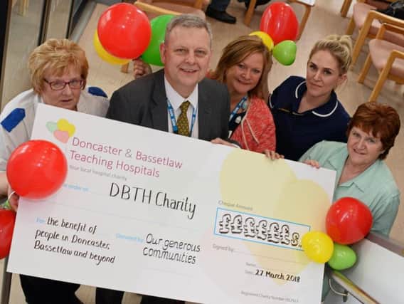 Richard Parker, Chief Executive and Suzy Brain-England OBE, Chair of the board, pictured with L-r Staff Nurse Izzy Dunkerley, Emily Woodward, Ward Manager and Glenys Birkinshaw, Healthcare Assistant, at Mexborough Montagu Hospital for the launch of the Doncaster & Basstlaw Teaching Hospitals Charity. Picture: Marie Caley NDFP Hospital Charity MC 1