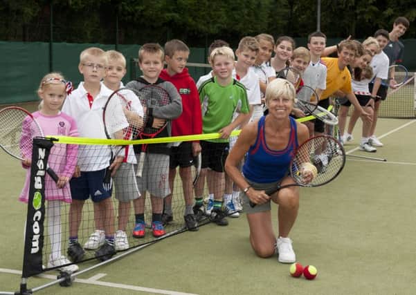 Liz Beaton, pictured with youngsters at Doncaster Lawn Tennis Club.