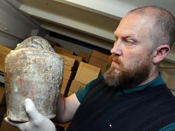 Peter Robinson, Heritage Doncaster Curator of Human History, holds a Canopic Jar, which has recently been on display in Barnsley. Picture: Marie Caley NDFP Museum MC 2