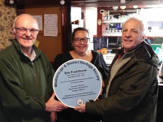 Coun Andy Pickering, Coun Bev Chapman, and vice chairman of Mexborough and District Heritage Society Bill Lawrence with the plaque in memory of Eric Brook.