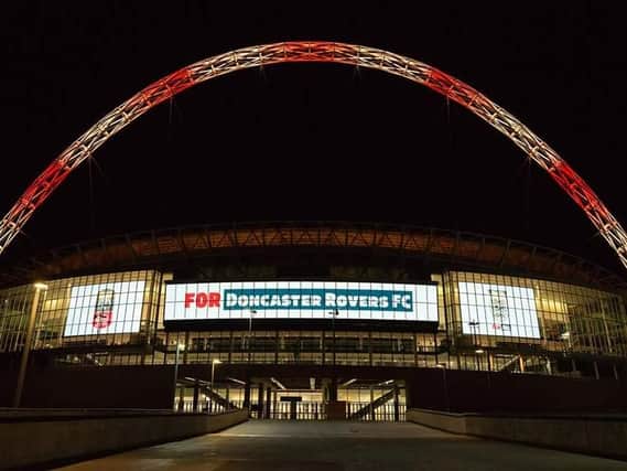 Wembley is lit up in the colours of Doncaster Rovers.
