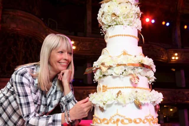 Andrea O'Brien with the cake creation
