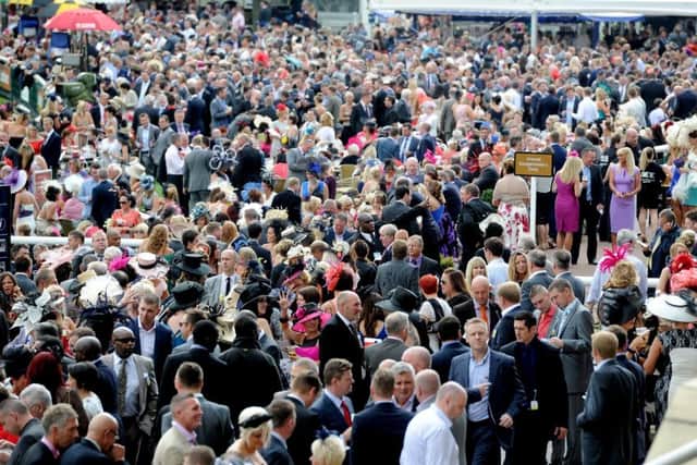 Date:12th September 2013.
The Ladbrokes St Leger Festival at Doncaster Racecourse, DFS Ladies Day. Pictured Crowds attending the meeting.